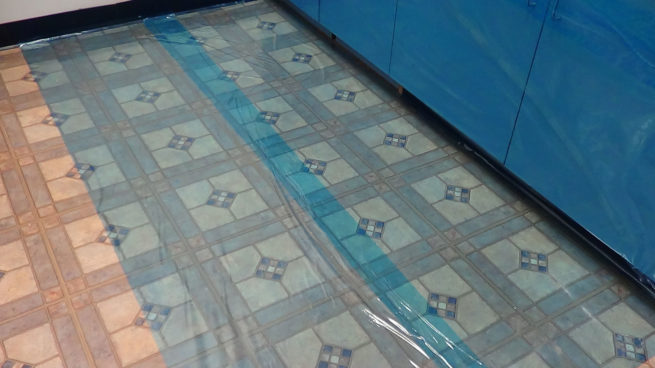 Multi-surface Cover self adhesive plastic sheeting on the floor